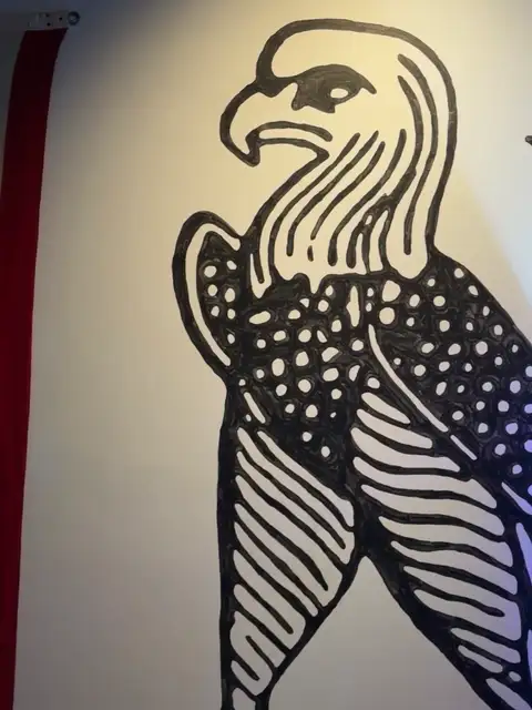 Bold graphic eagle soaring on the wall.